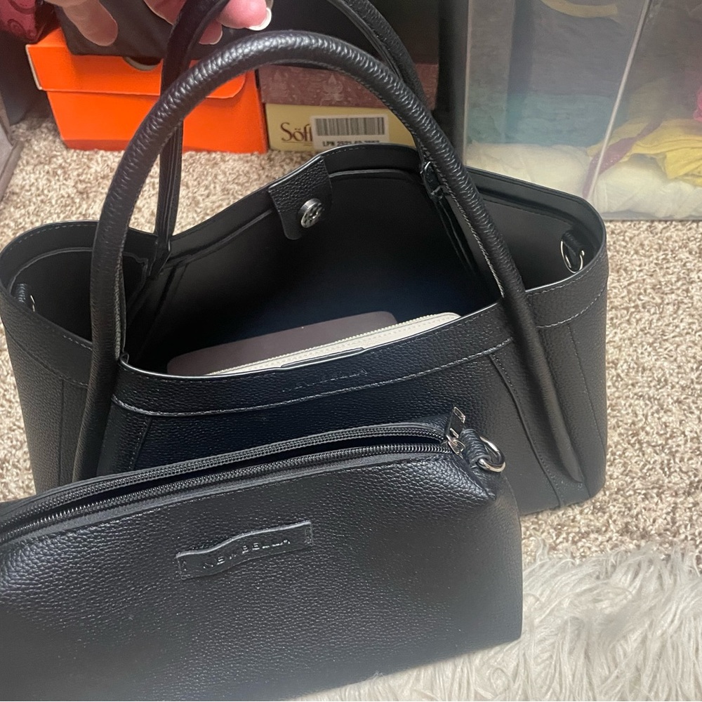 Newbella leather satchel has a cross body strap and make up bag included